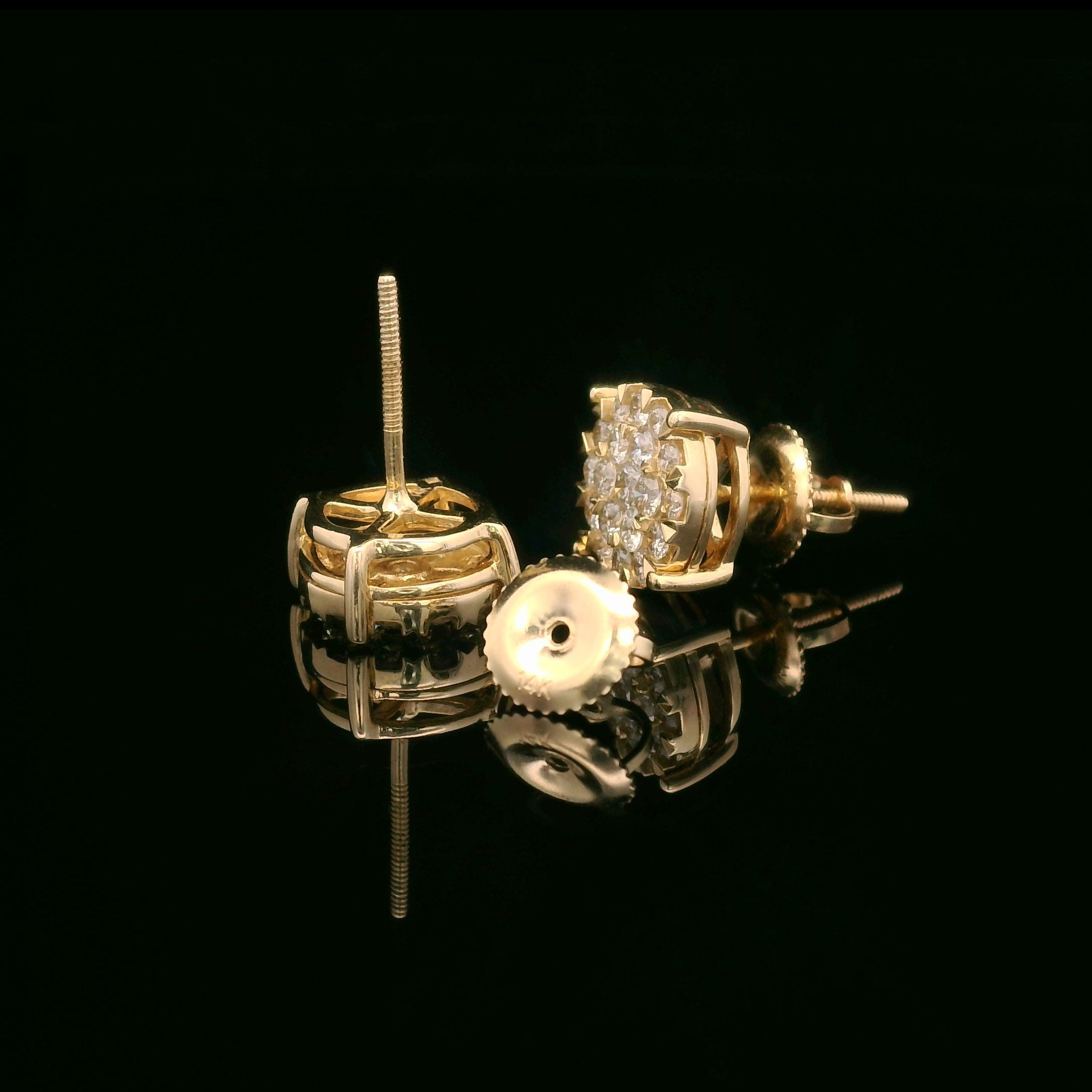 Round natural diamond studs in 14k yellow gold opened
